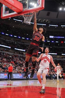 CHICAGO, IL - MARCH 18: Tre Jones 30 of the Chicago Bulls drives to the basket for a layup during the first half against the Toronto Raptors on March 18, 2026 at the United Center in Chicago, Illinois. (Photo by Melissa Tamez Icon Sportswire) NBA, Basketball Herren, USA MAR 18 Toronto Raptors at Chicago Bulls EDITORIAL USE ONLY Icon260318007