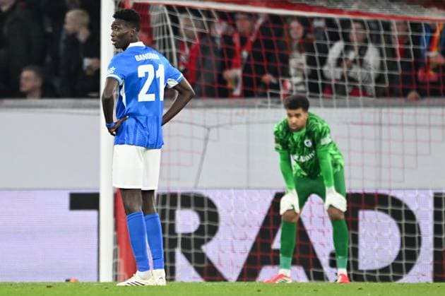 Genk s Ibrahima Sory Bangoura and Genk s goalkeeper Tobias Lawal look dejected during a soccer game between German Club Freiburg and Belgian KRC Genk in Freiburg im Breisgau, Germany on Thursday 19 March 2026, the return leg of the 1 16 Finals of the UEFA Europa League tournament. Genk won the first leg 1-0. JILLxDELSAUX  x168216580x