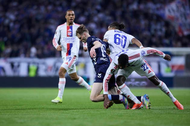 Olympique Lyonnais v Real Club Celta - Europa League DECINES-CHARPIEU, FRANCE - MARCH 19: Williot Swedberg of Celta de Vigo competes for the ball with Clinton Mata of Olympique Lyonnais during the UEFA Europa League 2025 26 Round of 16 Second Leg match between Olympique Lyonnais and Real Club Celta at OL Stadium on March 19, 2026 in Decines-Charpieu, France. DECINES-CHARPIEU OL Stadium Spain Copyright: xDiegoxSimonx