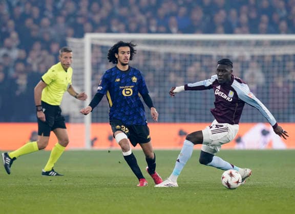 Birmingham, England, 19th March 2026. Ayyoub Bouaddi of LOSC Lille and Amadou Onana of Aston Villa during the Aston Villa vs LOSC Lille UEFA Europa League round of 16 match at Villa Park, Birmingham. Picture credit should read: Andrew Yates Sportimage EDITORIAL USE ONLY. No use with unauthorised audio, video, data, fixture lists, club league logos or live services. Online in-match use limited to 120 images, no video emulation. No use in betting, games or single club league player publications. SPI_023_AY_Villa_Lille SPI-4627-0023