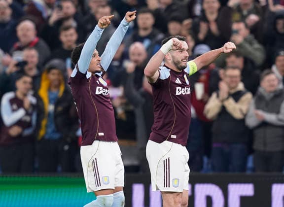 Birmingham, England, 19th March 2026. John McGinn of Aston Villa (r) celebrates scoring the first goal of the night with Jadon Sancho of Aston Villa (l) during the Aston Villa vs LOSC Lille UEFA Europa League round of 16 match at Villa Park, Birmingham. Picture credit should read: Andrew Yates Sportimage EDITORIAL USE ONLY. No use with unauthorised audio, video, data, fixture lists, club league logos or live services. Online in-match use limited to 120 images, no video emulation. No use in betting, games or single club league player publications. SPI_058_AY_Villa_Lille SPI-4627-0058