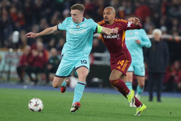 CALCIO - UEFA Europa League - AS Roma vs Bologna FC Rome, Italy - March 19, 2025: Lewis Ferguson (Central midfielder) of Bologna FC 1909, Donyell Malen (Forward) of AS Roma seen in action during the UEFA Europe League 2025 2026, Round of 16 second leg, between AS Roma vs Bologna FC 1909 at stadium in Rome Roma Italy  Copyright: xIPAxSport ABACAx
