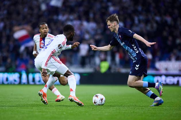 Olympique Lyonnais v Real Club Celta - Europa League DECINES-CHARPIEU, FRANCE - MARCH 19: Williot Swedberg of Celta de Vigo competes for the ball with Clinton Mata of Olympique Lyonnais during the UEFA Europa League 2025 26 Round of 16 Second Leg match between Olympique Lyonnais and Real Club Celta at OL Stadium on March 19, 2026 in Decines-Charpieu, France. DECINES-CHARPIEU OL Stadium Spain Copyright: xDiegoxSimonx