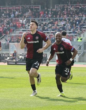 21.03.2026 - Fussball - Saison 2025 2026 - 2. Fussball - Bundesliga - 27. Spieltag: 1. FC Nürnberg FCN ( Club ) - 1. FC Kaiserslautern FCK ( Rote Roten Teufel ) - Sportfoto Zink DaMa - xdaxmax - DFL regulations prohibit any use of photographs as image sequences and or quasi-video - only for editorial use - Jubel Freude Torjubel nach Tor zum 1:0 - Luka Lochoshvili (24, 1. FC Nürnberg FCN ) Mohamed Ali Zoma (23, 1. FC Nürnberg FCN ) und Mannschaft Team jubelt freut sich - Torschütze: Luka Lochoshvili (24, 1. FC Nürnberg FCN )
