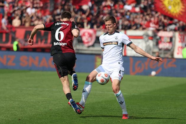 21.03.2026, xrekx, Fussball 2.Bundesliga, 1. FC Nuernberg - 1.FC Kaiserslautern v.l. Adam Markhiev (1.FC Nuernberg) Fabian Kunze (1.FC Kaiserslautern) Zweikampf, Aktion, action, battle for the ball (DFL DFB REGULATIONS PROHIBIT ANY USE OF PHOTOGRAPHS as IMAGE SEQUENCES and or QUASI-VIDEO) Nuernberg