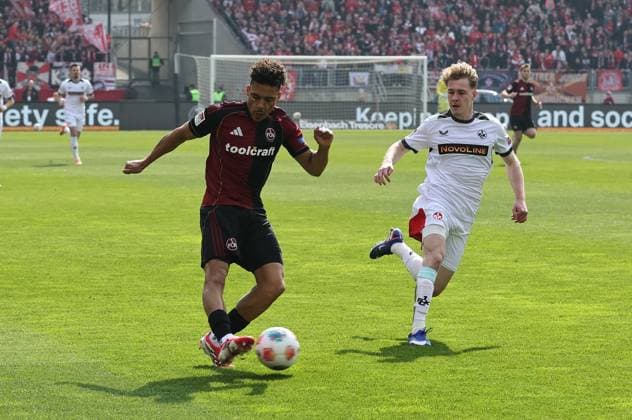 21.03.2026 - Fussball - Saison 2025 2026 - 2. Fussball - Bundesliga - 27. Spieltag: 1. FC Nürnberg FCN ( Club ) - 1. FC Kaiserslautern FCK ( Rote Roten Teufel ) - Sportfoto Zink DaMa - xdaxmax - DFL regulations prohibit any use of photographs as image sequences and or quasi-video - only for editorial use - Henri Koudossou (8, 1. FC Nürnberg FCN ) flankt Flanke