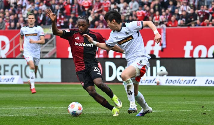 21.03.2026 - Fussball - Saison 2025 2026 - 2. Fussball - Bundesliga - 27. Spieltag: 1. FC Nürnberg FCN ( Club ) - 1. FC Kaiserslautern FCK ( Rote Roten Teufel ) - Sportfoto Zink - xwoxzix - DFL regulations prohibit any use of photographs as image sequences and or quasi-video - only for editorial use - Mohamed Ali Zoma (23, 1. FC Nürnberg FCN ) Ji-Soo Jisoo Kim (5, 1. FC Kaiserslautern FCK )