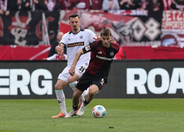21.03.2026 - Fussball - Saison 2025 2026 - 2. Fussball - Bundesliga - 27. Spieltag: 1. FC Nürnberg FCN ( Club ) - 1. FC Kaiserslautern FCK ( Rote Roten Teufel ) - Sportfoto Zink DaMa - xdaxmax - DFL regulations prohibit any use of photographs as image sequences and or quasi-video - only for editorial use - Mergim Berisha (20, 1. FC Kaiserslautern FCK ) Adam Markhiev (6, 1. FC Nürnberg FCN )