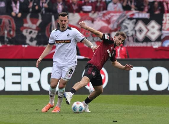 21.03.2026 - Fussball - Saison 2025 2026 - 2. Fussball - Bundesliga - 27. Spieltag: 1. FC Nürnberg FCN ( Club ) - 1. FC Kaiserslautern FCK ( Rote Roten Teufel ) - Sportfoto Zink DaMa - xdaxmax - DFL regulations prohibit any use of photographs as image sequences and or quasi-video - only for editorial use - Mergim Berisha (20, 1. FC Kaiserslautern FCK ) Adam Markhiev (6, 1. FC Nürnberg FCN )
