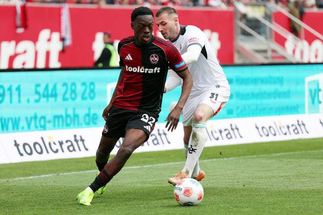 21.03.2026, xrekx, Fussball 2.Bundesliga, 1. FC Nuernberg - 1.FC Kaiserslautern v.l. Rabby Nzingoula (1.FC Nuernberg) Luca Sirch (1.FC Kaiserslautern) Zweikampf, Aktion, action, battle for the ball (DFL DFB REGULATIONS PROHIBIT ANY USE OF PHOTOGRAPHS as IMAGE SEQUENCES and or QUASI-VIDEO) Nuernberg