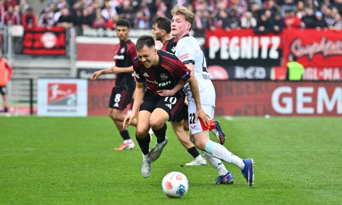 21.03.2026 - Fussball - Saison 2025 2026 - 2. Fussball - Bundesliga - 27. Spieltag: 1. FC Nürnberg FCN ( Club ) - 1. FC Kaiserslautern FCK ( Rote Roten Teufel ) - Sportfoto Zink - xwoxzix - DFL regulations prohibit any use of photographs as image sequences and or quasi-video - only for editorial use - Julian Justvan (10, 1. FC Nürnberg FCN ) Mika Haas (22, 1. FC Kaiserslautern FCK )