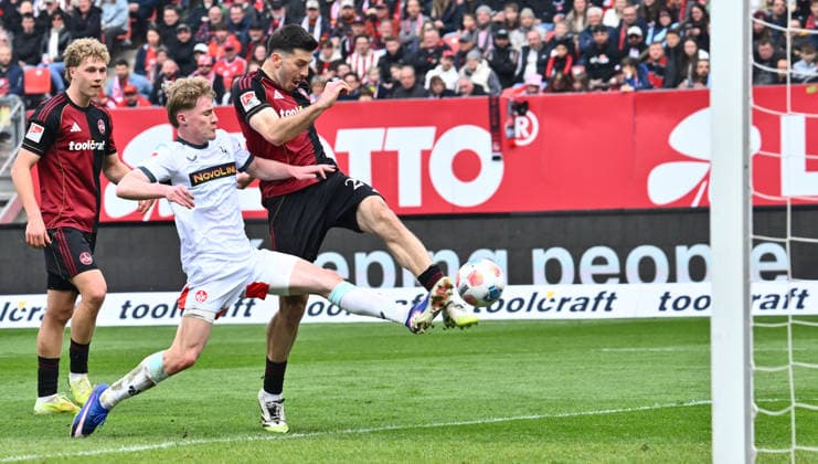 21.03.2026 - Fussball - Saison 2025 2026 - 2. Fussball - Bundesliga - 27. Spieltag: 1. FC Nürnberg FCN ( Club ) - 1. FC Kaiserslautern FCK ( Rote Roten Teufel ) - Sportfoto Zink - xwoxzix - DFL regulations prohibit any use of photographs as image sequences and or quasi-video - only for editorial use - Luka Lochoshvili (24, 1. FC Nürnberg FCN ) Mika Haas (22, 1. FC Kaiserslautern FCK ) Chance Torchance