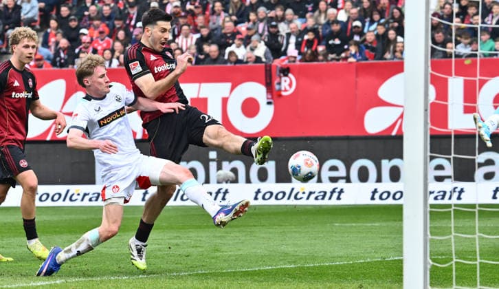 21.03.2026 - Fussball - Saison 2025 2026 - 2. Fussball - Bundesliga - 27. Spieltag: 1. FC Nürnberg FCN ( Club ) - 1. FC Kaiserslautern FCK ( Rote Roten Teufel ) - Sportfoto Zink - xwoxzix - DFL regulations prohibit any use of photographs as image sequences and or quasi-video - only for editorial use - Luka Lochoshvili (24, 1. FC Nürnberg FCN ) Mika Haas (22, 1. FC Kaiserslautern FCK ) Chance Torchance