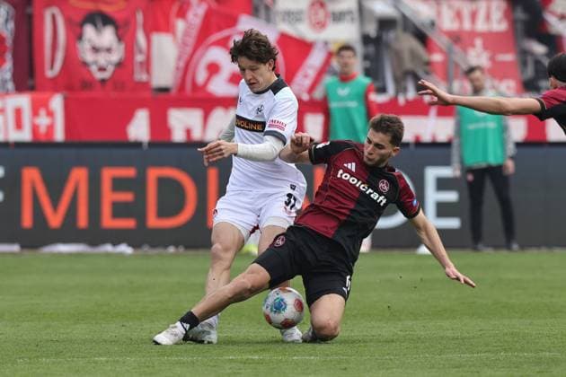 21.03.2026 - Fussball - Saison 2025 2026 - 2. Fussball - Bundesliga - 27. Spieltag: 1. FC Nürnberg FCN ( Club ) - 1. FC Kaiserslautern FCK ( Rote Roten Teufel ) - Sportfoto Zink DaMa - xdaxmax - DFL regulations prohibit any use of photographs as image sequences and or quasi-video - only for editorial use - Leon Robinson (37, 1. FC Kaiserslautern FCK ) Adam Markhiev (6, 1. FC Nürnberg FCN )
