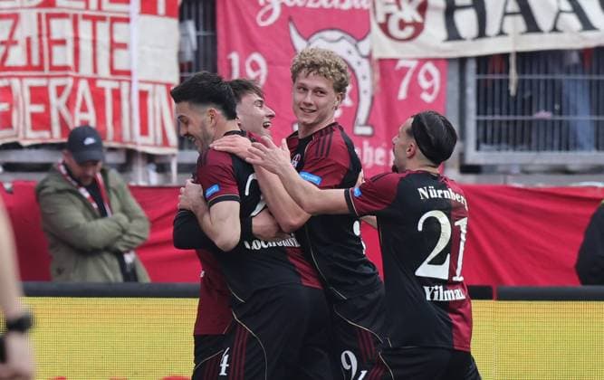 21.03.2026 - Fussball - Saison 2025 2026 - 2. Fussball - Bundesliga - 27. Spieltag: 1. FC Nürnberg FCN ( Club ) - 1. FC Kaiserslautern FCK ( Rote Roten Teufel ) - Sportfoto Zink DaMa - xdaxmax - DFL regulations prohibit any use of photographs as image sequences and or quasi-video - only for editorial use - Jubel Freude Torjubel nach Tor zum 3:0 - Luka Lochoshvili (24, 1. FC Nürnberg FCN ) und Mannschaft Team jubelt freut sich - Torschütze: Luka Lochoshvili (24, 1. FC Nürnberg FCN )