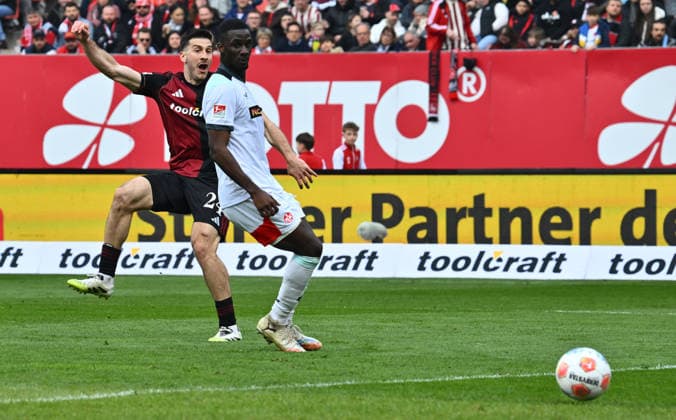 21.03.2026 - Fussball - Saison 2025 2026 - 2. Fussball - Bundesliga - 27. Spieltag: 1. FC Nürnberg FCN ( Club ) - 1. FC Kaiserslautern FCK ( Rote Roten Teufel ) - Sportfoto Zink - xwoxzix - DFL regulations prohibit any use of photographs as image sequences and or quasi-video - only for editorial use - Luka Lochoshvili (24, 1. FC Nürnberg FCN ) erzielt Treffer Tor Torschuß zum 3:0 gegen Maxwell Gyamfi (4, 1. FC Kaiserslautern FCK ) -