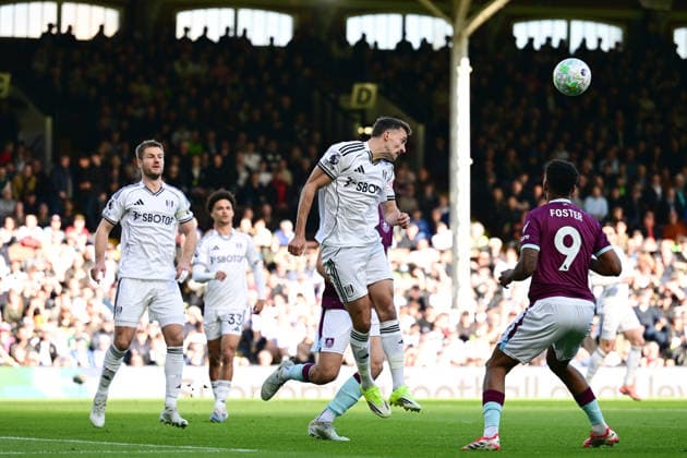 Fulham v Burnley, Premier League Fulham defender Timothy Castagne (21) heads the ball under pressure from Burnley froward Lyle Foster (9) during the Premier League match between Fulham and Burnley at Craven Cottage, London, UK on 21 March 2026. London Craven Cottage Greater London UK Editorial use only DataCo restrictions apply See www.football-dataco.com , Copyright: xDennisxGoodwinx PSI-23930-0022