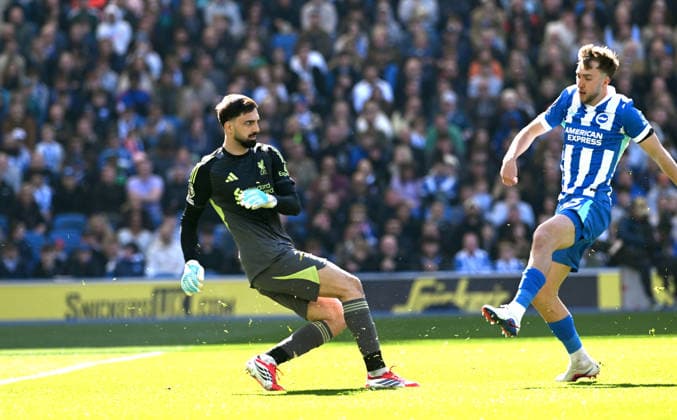 Giorgi Mamarsdashvili of Liverpool clears the ball from the onrushing Jack Hinshelwood of Brighton during the Premier League match between Brighton and Hove Albion and Liverpool at the American Express Stadium , Brighton , UK - 21st March 2026 Brighton & Hove Albion vs Liverpool Premier League Football, Amex Stadium, Sussex, United Kingdom - 21 Mar 2026Brighton Amex Stadium Sussex United Kingdom Editorial use only. No merchandising. For Football images FA and Premier League restrictions apply inc. no internet mobile usage without FAPL license - for details contact Football Dataco  Copyright: xSimonxDack TPI Shutterstockx 16784403an