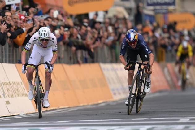 Slovenian Tadej Pogacar (L) wins before British Tom Pidcock the sprint at the finish of the Milano-Sanremo one day cycling race for men, 298km from Milan to San Remo, Italy, Saturday 21 March 2026. DAVIDxPINTENS  x168470307x