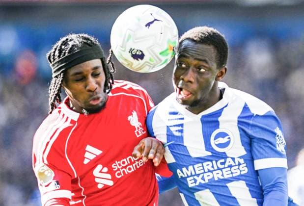 Jeremie Frimpong of Liverpool on the left competes for the ball with Yankuba Minteh of Brighton during the Premier League match between Brighton and Hove Albion and Liverpool at the American Express Stadium , Brighton , UK - 21st March 2026 Brighton & Hove Albion vs Liverpool Premier League Football, Amex Stadium, Sussex, United Kingdom - 21 Mar 2026Brighton Amex Stadium Sussex United Kingdom Editorial use only. No merchandising. For Football images FA and Premier League restrictions apply inc. no internet mobile usage without FAPL license - for details contact Football Dataco  Copyright: xSimonxDack TPI Shutterstockx 16784403aw