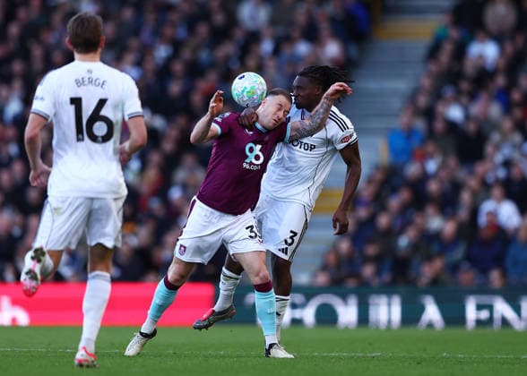 21st March 2026; Craven Cottage, Fulham, London, England; Premier League Football, Fulham versus Burnley; Ashley Barnes of Burnley under pressure from Calvin Bassey of Fulham  JPxFletcher Content restricted for UK based newspaper