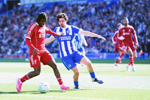 Brighton and Hove Albion v Liverpool, Premier League Jeremie Frimpong Defender of Liverpool and Ferdi KadÄ±oÄülu Defender of Brighton and Hove Albion jostles for the ball during the Premier League match between Brighton and Hove Albion and Liverpool at the American Express Stadium, Brighton and Hove, UK on 21 March 2026. Brighton and Hove American Express Stadium East Sussex UK Editorial use only DataCo restrictions apply See www.football-dataco.com , Copyright: xJeffxMoodx PSI-23949-0055