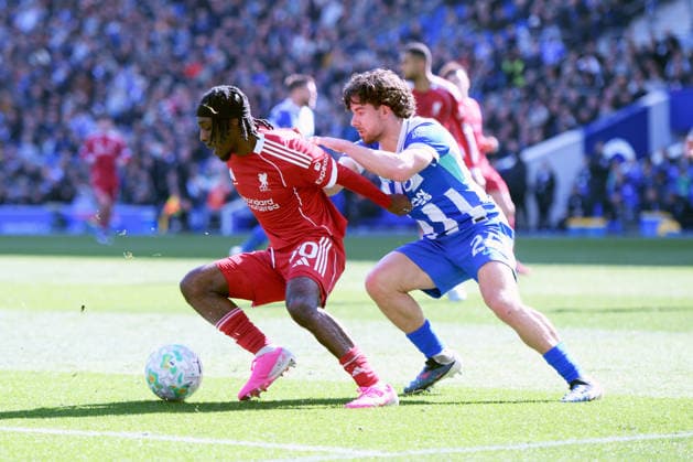 Brighton and Hove Albion v Liverpool, Premier League Jeremie Frimpong Defender of Liverpool and Ferdi KadÄ±oÄülu Defender of Brighton and Hove Albion jostles for the ball during the Premier League match between Brighton and Hove Albion and Liverpool at the American Express Stadium, Brighton and Hove, UK on 21 March 2026. Brighton and Hove American Express Stadium East Sussex UK Editorial use only DataCo restrictions apply See www.football-dataco.com , Copyright: xJeffxMoodx PSI-23949-0057