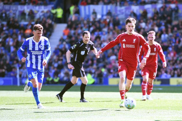 Brighton and Hove Albion v Liverpool, Premier League Referee Darren England keeps a close eye on Florian Wirtz Midfielder of Liverpool as he makes a run on goal during the Premier League match between Brighton and Hove Albion and Liverpool at the American Express Stadium, Brighton and Hove, UK on 21 March 2026. Brighton and Hove American Express Stadium East Sussex UK Editorial use only DataCo restrictions apply See www.football-dataco.com , Copyright: xJeffxMoodx PSI-23949-0059