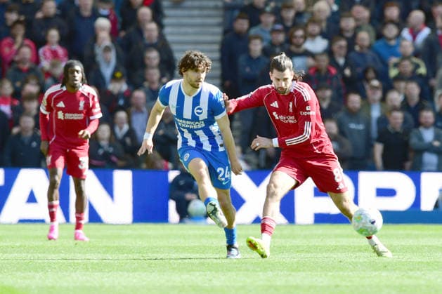 Brighton and Hove Albion v Liverpool, Premier League Ferdi KadÄ±oÄülu Defender of Brighton and Hove Albion and Dominik Szoboszlai Midfielder of Liverpool during the Premier League match between Brighton and Hove Albion and Liverpool at the American Express Stadium, Brighton and Hove, UK on 21 March 2026. Brighton and Hove American Express Stadium East Sussex UK Editorial use only DataCo restrictions apply See www.football-dataco.com , Copyright: xJeffxMoodx PSI-23949-0067