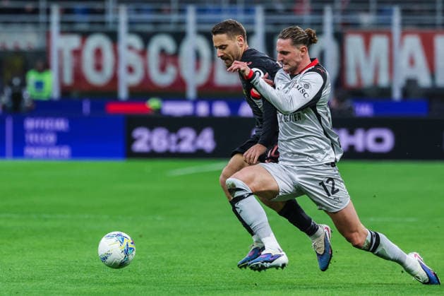 CALCIO - Serie A - AC Milan vs Torino FC Adrien Rabiot of AC Milan competes for the ball with Nikola Vlasic of Torino FC during Serie A 2025 26 football match between AC Milan and Torino FC at San Siro Stadium in Milan Milan Italy  Copyright: xIPAxSport ABACAx