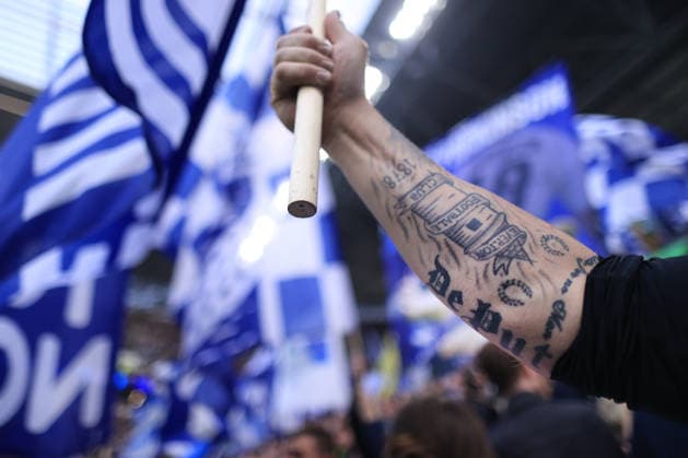 Football - Premier League - Everton v Chelsea 21st March 2026 - Premier League - Everton v Chelsea - An Everton fan reveals a tattoo on his arm as he waves a flag before the match - Photo: Simon Stacpoole Offside. Liverpool UK Copyright: xSimonxStacpoolexOffside