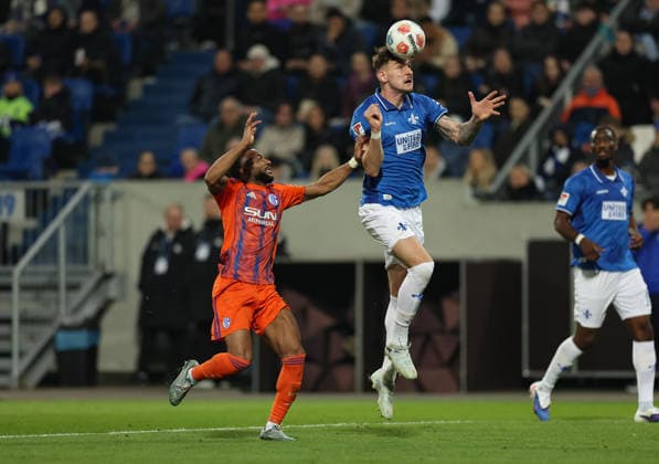 21.03.2026, Fussball 2. Bundesliga, SV Darmstadt 98 - FC Schalke 04, v.l., Moussa Sylla (FC Schalke 04), Matej Maglica (SV Darmstadt 98) DFL DFB REGULATIONS PROHIBIT ANY USE OF PHOTOGRAPHS AS IMAGE SEQUENCES AND OR QUASI-VIDEO. xdcx