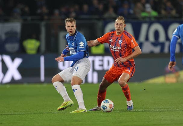 21.03.2026, Fussball 2. Bundesliga, SV Darmstadt 98 - FC Schalke 04, v.l., Niklas Schmidt (SV Darmstadt 98), Timo Becker (FC Schalke 04) DFL DFB REGULATIONS PROHIBIT ANY USE OF PHOTOGRAPHS AS IMAGE SEQUENCES AND OR QUASI-VIDEO. xdcx