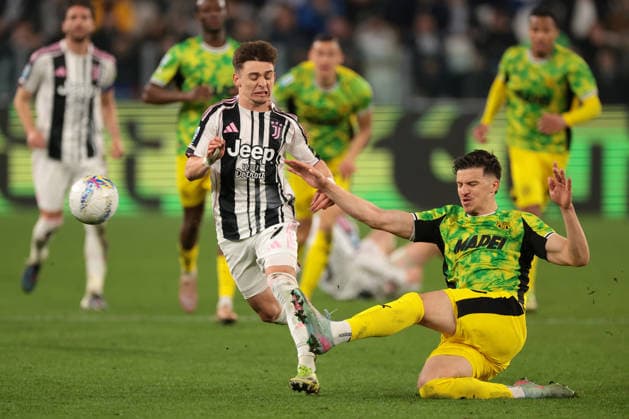 Turin, Italy, 21st March 2026. Tarik Muharemovic of US Sassuolo clears the ball from Francisco Conceicao of Juventus during the Juventus vs Sassuolo Serie A match at Allianz Stadium, Turin. Picture credit should read: Jonathan Moscrop Sportimage EDITORIAL USE ONLY. No use with unauthorised audio, video, data, fixture lists, club league logos or live services. Online in-match use limited to 120 images, no video emulation. No use in betting, games or single club league player publications. SPI_029_JM_JUVE_SASSUOLO SPI-4620-0029