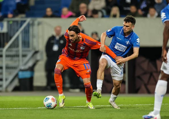 21.03.2026, Fussball 2. Bundesliga, SV Darmstadt 98 - FC Schalke 04, v.l., Kenan Karaman (FC Schalke 04), Sergio Lopez (SV Darmstadt 98) DFL DFB REGULATIONS PROHIBIT ANY USE OF PHOTOGRAPHS AS IMAGE SEQUENCES AND OR QUASI-VIDEO. xdcx