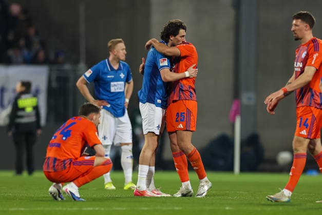21.03.2026, Fussball 2. Bundesliga, SV Darmstadt 98 - FC Schalke 04, v.l., Fraser Hornby (SV Darmstadt 98), Nikola Katic (FC Schalke 04) DFL DFB REGULATIONS PROHIBIT ANY USE OF PHOTOGRAPHS AS IMAGE SEQUENCES AND OR QUASI-VIDEO. xdcx