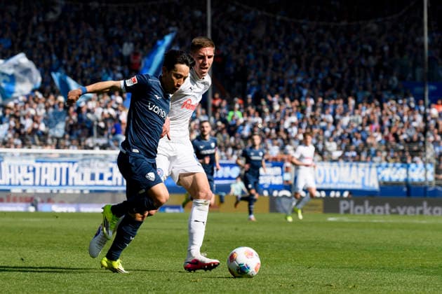 Koji Miyoshi (VfL Bochum) und David Zec (Holstein Kiel) im Kampf um den Ball waehrend des spiels der 2. Bundesliga zwischen VfL Bochum und Holstein Kiel, Vonovia Ruhrstadion am 22. March 2026 in Bochum, Deutschland. (Foto von Max Maiwald DeFodi Images) +++ Koji Miyoshi (VfL Bochum) und David Zec (Holstein Kiel) battle for the ball during the 2. Bundesliga match between VfL Bochum and Holstein Kiel at Vonovia Ruhrstadion on March 22, 2026 in Bochum, Germany. (Photo by Max Maiwald DeFodi Images) (Photo by Max Maiwald DeFodi Images) -