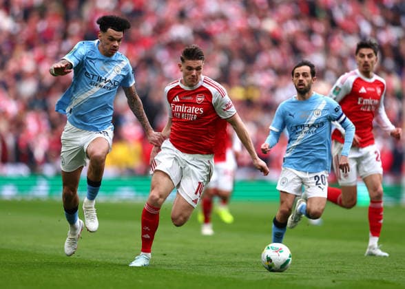 22nd March 2026; Wembley Stadium, London, England; Carabao Cup Final Football, Arsenal versus Manchester City; Viktor Gyokeres of Arsenal under pressure from Nico O Reilly of Manchester City  JPxFletcher Content restricted for UK based newspaper