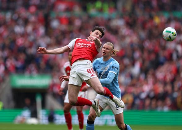 22nd March 2026; Wembley Stadium, London, England; Carabao Cup Final Football, Arsenal versus Manchester City; Declan Rice of Arsenal heads the ball over Erling Haaland of Manchester City  JPxFletcher Content restricted for UK based newspaper