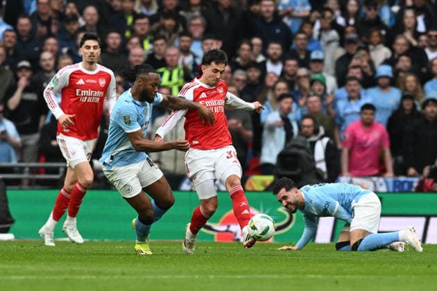 Arsenal v Manchester City, EFL Cup, Cup Final Antoine Semenyo (42) of Manchester City battles for possession with Martin Zubimendi (36) of Arsenal during the EFL Cup match between Arsenal and Manchester City at Wembley Stadium, London, UK on 22 March 2026. London Wembley Stadium Greater London UK Editorial use only DataCo restrictions apply See www.football-dataco.com , Copyright: xGrahamxHuntx PSI-23937-0049