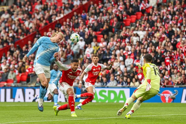 Carabao Cup Final Arsenal v Manchester City Erling Haaland of Manchester City heads the ball toward goal under challenge from William Saliba of Arsenal during the Carabao Cup Final match Arsenal vs Manchester City at Emirates, London, United Kingdom on 22 March 2026 (Photo by Alfie Cosgrove News Images) London Emirates Greater London United Kingdom Copyright: xAlfiexCosgrove NewsxImagesx
