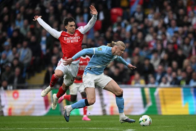 Arsenal v Manchester City, EFL Cup, Cup Final Erling Haaland (9) of Manchester City on the attack battles for possession with Martin Zubimendi (36) of Arsenal during the EFL Cup match between Arsenal and Manchester City at Wembley Stadium, London, UK on 22 March 2026. London Wembley Stadium Greater London UK Editorial use only DataCo restrictions apply See www.football-dataco.com , Copyright: xGrahamxHuntx PSI-23937-0064