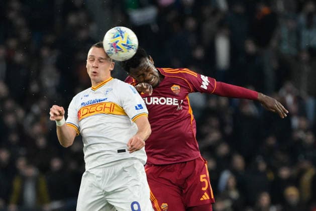 Lecceâ??s Nikola Stulic and Romaâ??s Evan Ndicka during the Italian Football Championship League A Enilive 2025 2026 match between AS Roma vs US Lecce at the Olimpic Stadium in Rome on 22 March 2026.  Copyright: xFabrizioxCorradetti IPAxSportx xipa-agency.netx xx IPA_73299650 IPA_Agency_IPA73299650