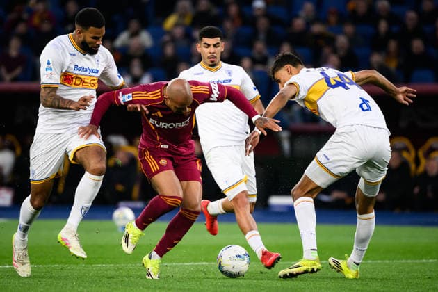 Jamil Siebert of US Lecce, Donyell Malen of AS Roma and Tiago Gabriel of US Lecce compete for the ball during the Serie A 2025 2026 football match between AS Roma and US Lecce at Stadio Olimpico in Rome (Italy), March 22, 2026. AndreaxStaccioli