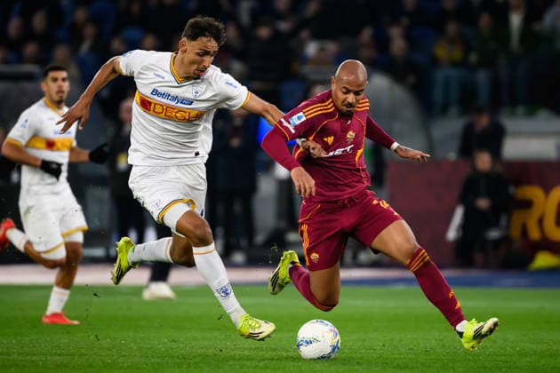 Tiago Gabriel of US Lecce and Donyell Malen of AS Roma compete for the ball during the Serie A 2025 2026 football match between AS Roma and US Lecce at Stadio Olimpico in Rome (Italy), March 22, 2026. AndreaxStaccioli