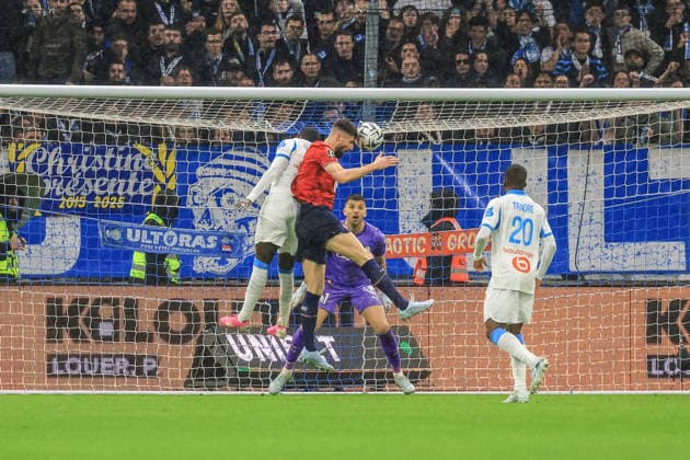 France - Ligue 1 McDonald - Olympique de Marseille vs Lille OSC - 22 03 2026 FRANCE, MARSEILLE, MARCH 22. Olivier Giroud of Lille heads the ball under pressure from Timothy Weah of Marseille and scores his team s second goal during the Ligue 1 McDonald football match between Olympique de Marseille and Lille OSC on March 22, 2026 at Stade Velodrome in Marseille, France. Photo by Manuel Blondeau AOP.Press Marseille Stade Velodrome Provence France Copyright: x ManuelxBlondeau AOP.Pressx AOP20260322-0010