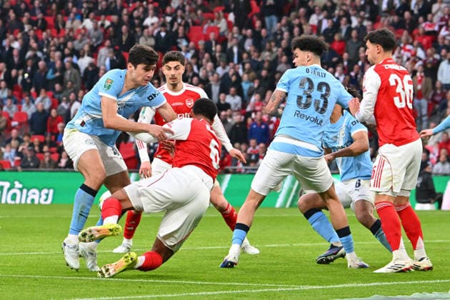 Arsenal v Manchester City, EFL Cup, Cup Final Abdukodir Khusanov (45)of Manchester City battles with Gabriel (6) of Arsenal during the EFL Cup match between Arsenal and Manchester City at Wembley Stadium, London, UK on 22 March 2026. London Wembley Stadium Greater London UK Editorial use only DataCo restrictions apply See www.football-dataco.com , Copyright: xGrahamxHuntx PSI-23937-0309