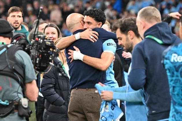 Arsenal v Manchester City, EFL Cup, Cup Final Matheus Nunes (27) of Manchester City is hugged by Manchester City manager Pep Guardiola as they celebrate winning the Carabao Cup during the EFL Cup match between Arsenal and Manchester City at Wembley Stadium, London, UK on 22 March 2026. London Wembley Stadium Greater London UK Editorial use only DataCo restrictions apply See www.football-dataco.com , Copyright: xGrahamxHuntx PSI-23937-0326