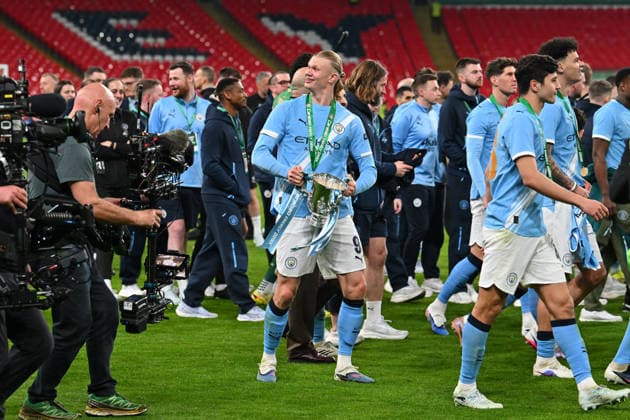 Arsenal v Manchester City, EFL Cup, Cup Final Erling Haaland (9) of Manchester City walking with the trophy during the post match celebrations after the EFL Cup match between Arsenal and Manchester City at Wembley Stadium, London, UK on 22 March 2026. London Wembley Stadium Greater London UK Editorial use only DataCo restrictions apply See www.football-dataco.com , Copyright: xGrahamxHuntx PSI-23937-0328