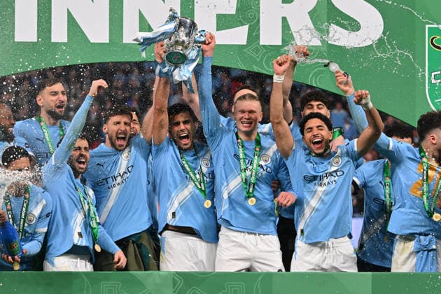 Arsenal v Manchester City, EFL Cup, Cup Final Rodri (16) of Manchester City and Erling Haaland (9) of Manchester City lift the Carabao Cup trophy during the post match celebrations after the EFL Cup match between Arsenal and Manchester City at Wembley Stadium, London, UK on 22 March 2026. London Wembley Stadium Greater London UK Editorial use only DataCo restrictions apply See www.football-dataco.com , Copyright: xGrahamxHuntx PSI-23937-0333
